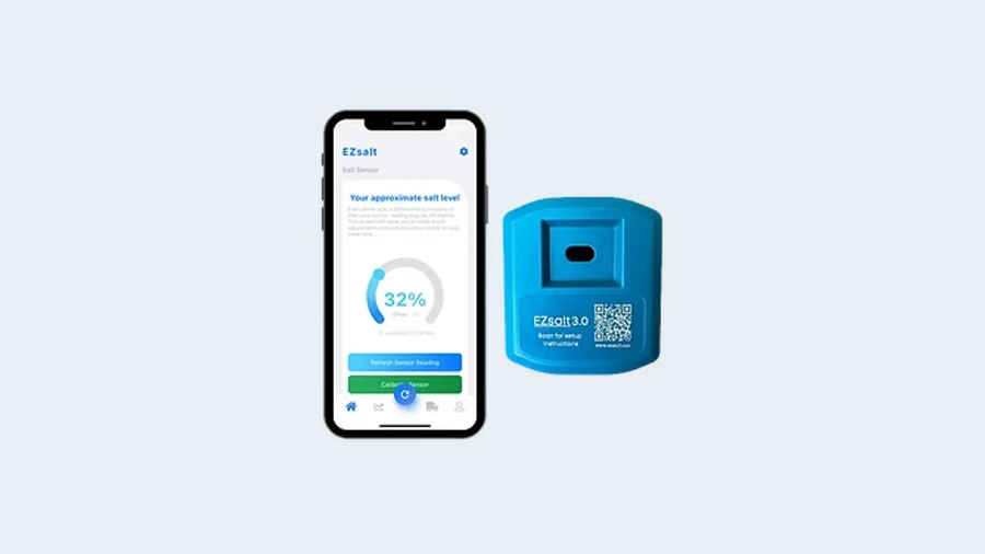 The EZsalt smart salt sensor next to a phone showing a live brine tank salt level reading