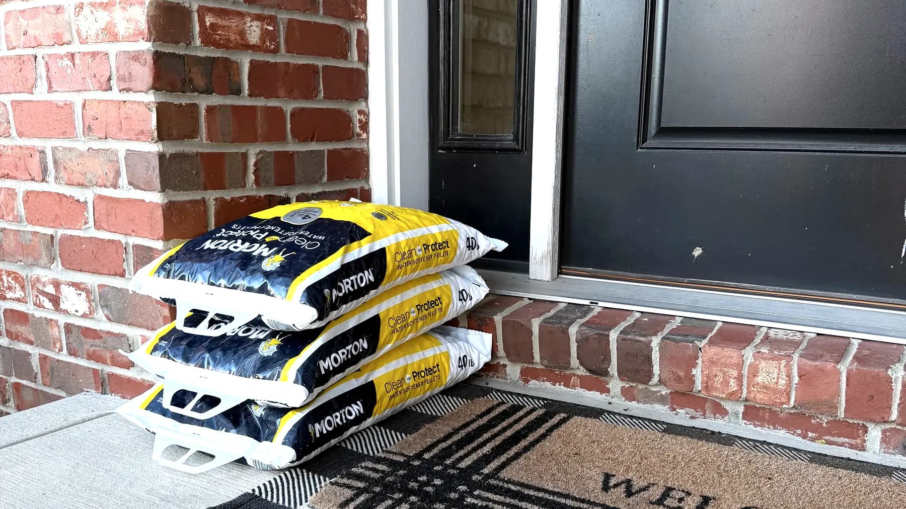 Bags of Morton water softener salt delivered and stacked on a customer's front porch in Peoria, Illinois